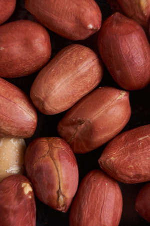 macro view, group of peanuts on black background. Arachis hypogaeaの写真素材