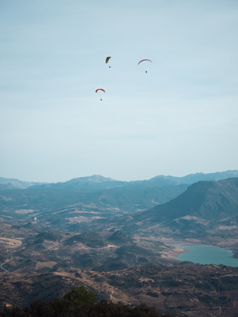 Paragliders flying in the blue sky over the mountains., Sierra de Algodonales, La Muela, Andalusia,...