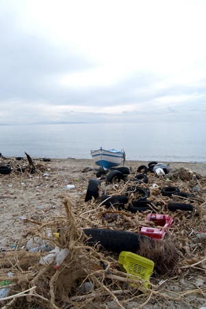 environmental pollution  A beach oh the Calabria with waste and polluting materialの写真素材