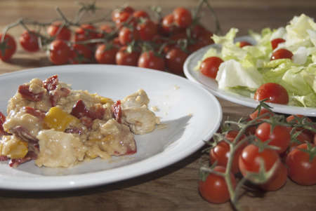 An Italian dish: chicken with peppersの写真素材