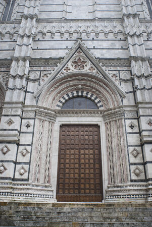 Detail of the facade of the Siena Cathedral: The entrance doorの写真素材