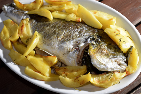traditinal  Italian sea dish: baked sea bream with potatoesの写真素材