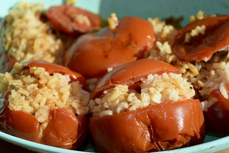 a vegetarian and healthy recipe: tomatoes with riceの写真素材