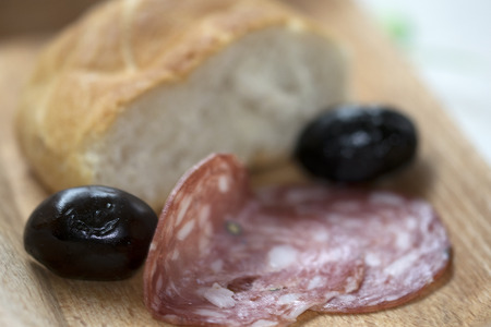 fast snack with delicacy with toast and salamiの写真素材