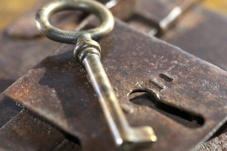 vintage objects with a handmade old lock in iron with keyの写真素材
