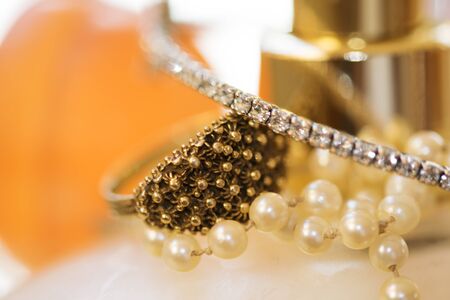 charm and fashion: wedding ring and other jewels on colored soapの写真素材