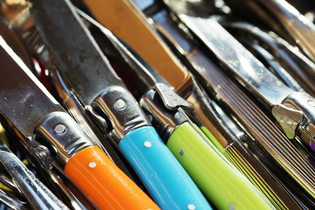 Motives repetitives by colored handles of knivesの写真素材