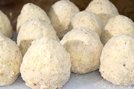 the real recipe of sicilian arancini with minced meat peas mozzarella and saffronの写真素材