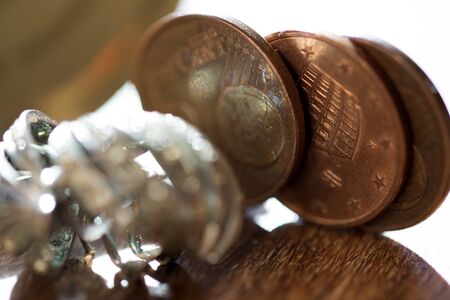 concept of domestic economy through an image of some cent over a tableの写真素材