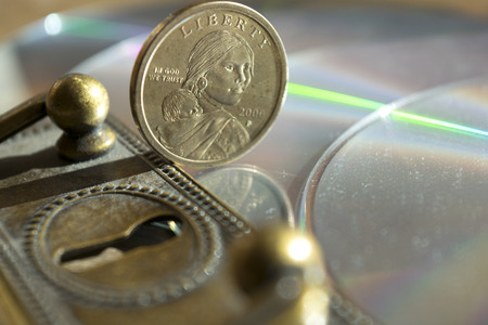 concept of monetary and banking security through a keyhole and some money