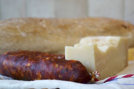 bread spicy salami and parmesan for a fast brunchの写真素材