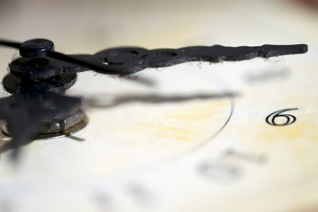 concept of time with the detail of the hands of an old clockの写真素材