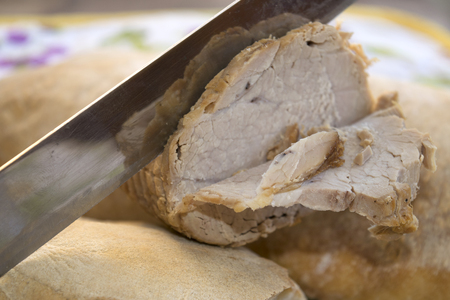 roast of veal sliced with a cuisine knifeの写真素材