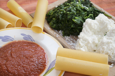 making ricotta and spinach cannelloni with the ingredients for the preparationの写真素材