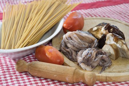 spaghetti mare e monti with porcini mushrooms and squidsの写真素材