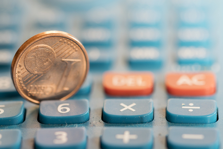 concept of business and money with one cent of Euro and a calculator keyboardの写真素材