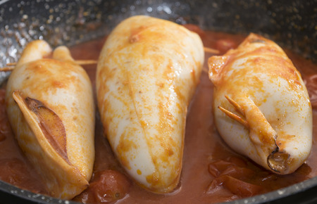 stuffed squids stir-fried with tomato sauceの写真素材