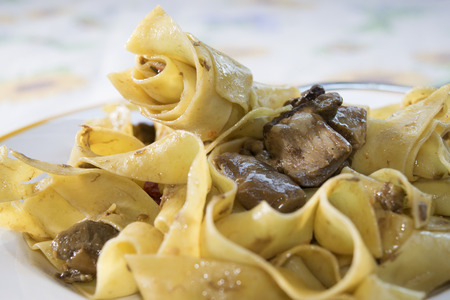 pappardelle with porcini mushrooms and cherry tomatoesの写真素材