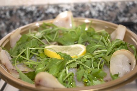 smoked tuna with rocket and lemonの写真素材