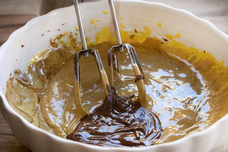 preparing a chocolate cake with  the ingredients worked with a food-mixerの写真素材