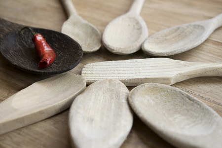 series of wooden spoons with a hot chilliの写真素材
