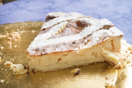 wedge of pastiera the traditional Naples cake with ricotta cream and icing sugarの写真素材