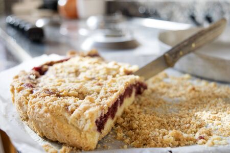 home made wedge of sbriciolata cake or jam crumble tart