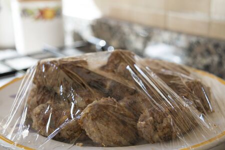 fried meatballs wraped with plastic wrapの写真素材