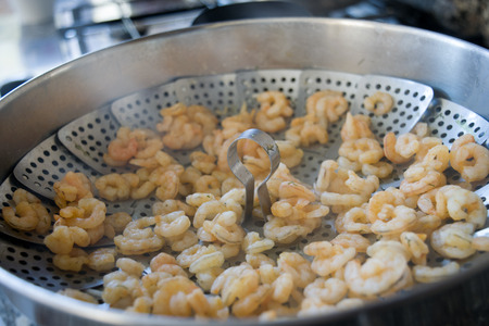 steamed shrimps on a metallic basket for steam cookingの写真素材