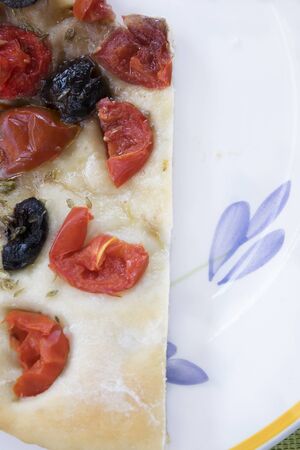 vegetarian pizza with black olives and cherry tomatoesの写真素材