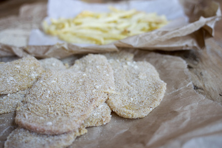 breaded veal cutlet with french friesの写真素材