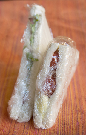 stuffed take away sandwiches wrapped in transparent filmの写真素材
