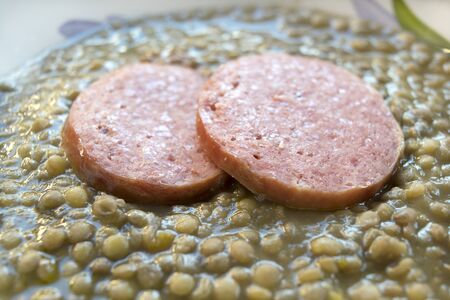 sliced cotechino with lentils tipycal Italian christmas dishの写真素材