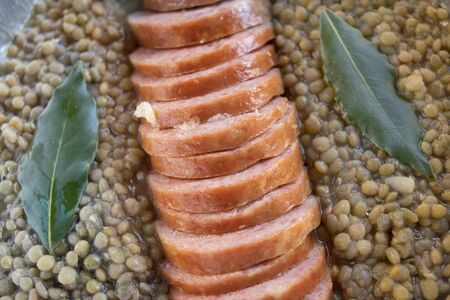 sliced cotechino in lintils soup with bayの写真素材