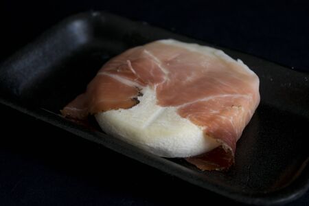 raw tomino cheese with cured hamの写真素材