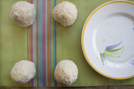 just prepared sicilian arancini with their typical  filling before being friedの写真素材