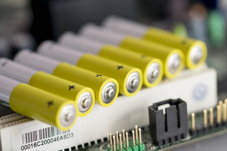 Colored alkaline batteries organized on a electronic board