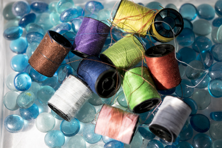 flat lay of colored reels of cotton 