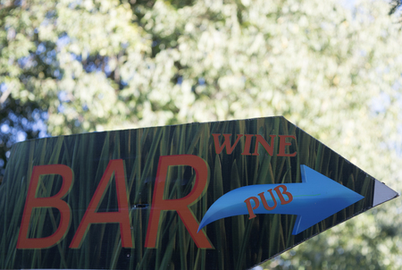 direction for a wine-bare througha sign