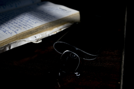 old manuscript diary illumined from lateral lightの写真素材