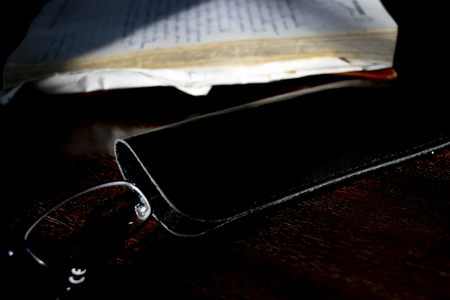 old manuscript diary illumined from lateral light