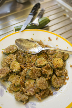 slices of breaded and gratineed zucchiniの写真素材