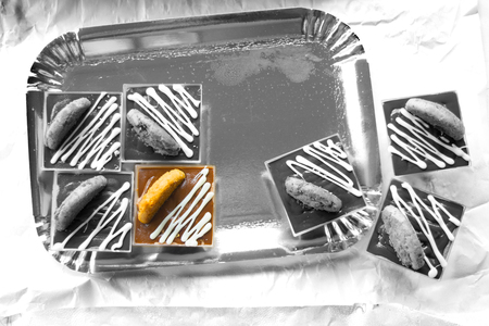 colored pastry made with melted chocolate on black and white background