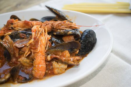 mixed seafood sauce in a dish to season spaghetti pastaの写真素材