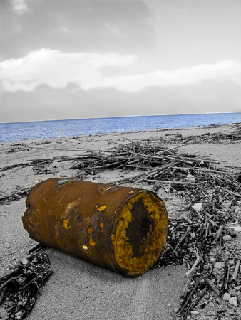 beach in Calabria polluted from litter in a monochome photo with a few parts at colorの写真素材