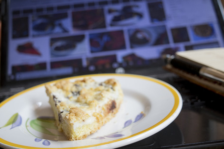 break work in office with a wedge of cream tart