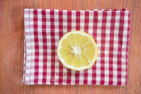 fresh half of lemon on a red and white napkinの写真素材