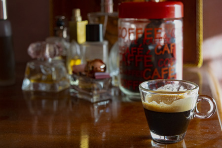 foamy extra strong coffee espresso on a wooden background