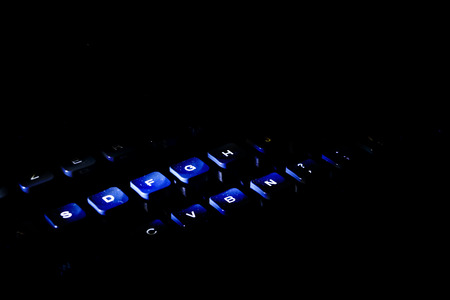 keyboard of an old typewriter lit with drammatic lightの写真素材