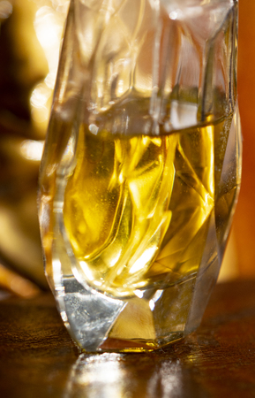 detail of an elegant perfume bottle in a romantic settingの写真素材